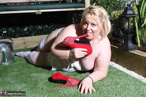 Pierced pussy bbw in red heels and white stockings riding huge dildo on the bench outdoors - Picture 20