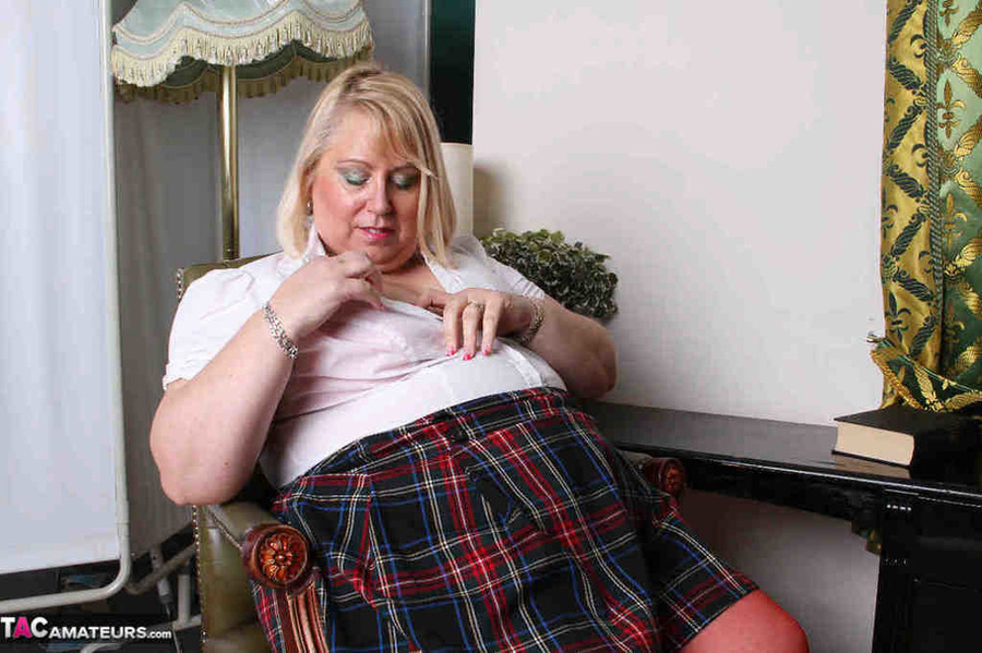 High heeled bbw in red stockings wiggles out of red undies and plaid miniskirt to expose her naked goods - XXXonXXX - Pic 2