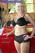 Curvacious curly haired blonde momma wearing black bra and laced undies