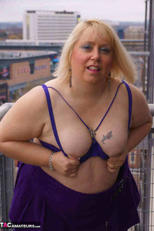 High heeled bbw in black stockings and purple miniskirt sheds blue bra and exposing her pierced snatch on the balcony - XXXonXXX - Pic 10