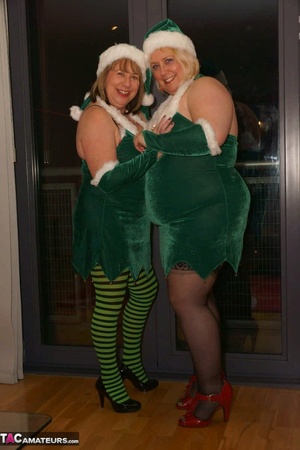 Blonde bbw and her brunette mate posing in green x-mas outfit before enjoying lesbian pussy licking on the couch - XXXonXXX - Pic 2