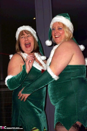 Blonde bbw and her brunette mate posing in green x-mas outfit before enjoying lesbian pussy licking on the couch - XXXonXXX - Pic 3