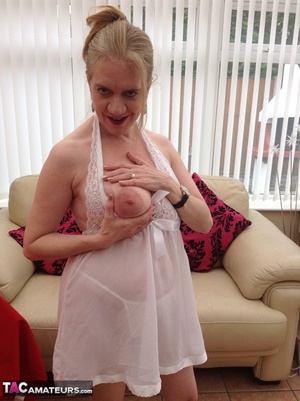 Big breasted granny wiggles out of white dress and panty to expose her shaved twat - Picture 3