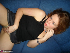 Big breasted redhead in leather boots sheds miniskirt and grey panty just to expose her shaved vagina - XXXonXXX - Pic 7