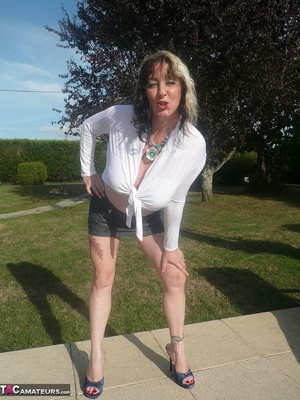 High heeled mom in white top and grey miniskirt teasing outdoors and showing her pierced vagina - XXXonXXX - Pic 2