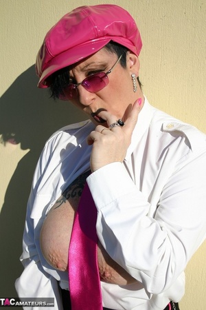 Busty chick in sunglasses and pink latex cap sheds leather coat and dildoing her pussy outdoors before giving a head - Picture 6