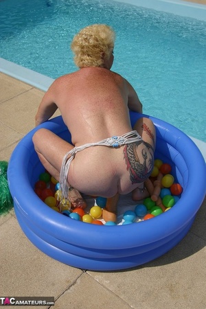 Chubby blonde with big breast dildoing her pierced vagina in the inflatable pool outdoors - XXXonXXX - Pic 20