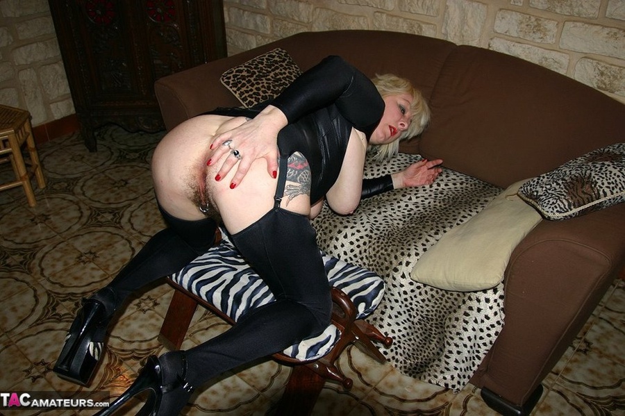 Busty blonde in black outfit and stockings toying her hairy twat with various dildos on the couch - XXXonXXX - Pic 16