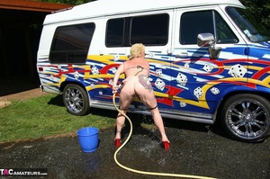 Huge boobed blonde in sunglasses and high heels washing car and her shaved coochie with water hose outdoors - XXXonXXX - Pic 16