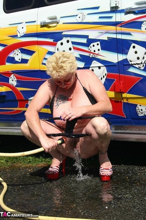 Huge boobed blonde in sunglasses and high heels washing car and her shaved coochie with water hose outdoors - XXXonXXX - Pic 19