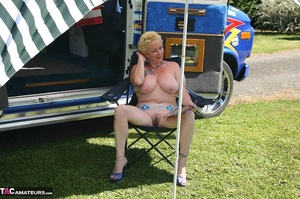 Chubby blonde with hairy pussy and huge boobs sitting on the chair and smoking outdoors - XXXonXXX - Pic 3