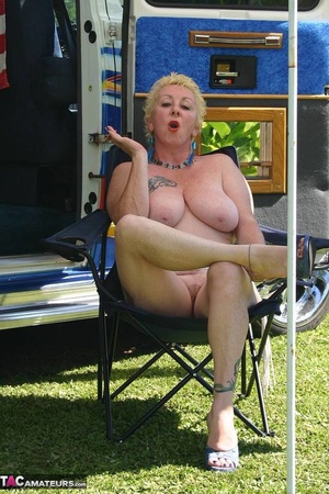 Chubby blonde with hairy pussy and huge boobs sitting on the chair and smoking outdoors - XXXonXXX - Pic 15