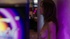 Dazed, naked woman walks slowly and aimlessly through a crowded casino.