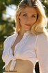 Big boobed blonde in leather boots sheds jeans shorts and white panty
