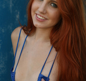 Blue eyed redhead teasing in sexy blue lingerie and exposing small tits