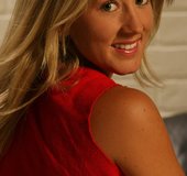 Red nailed blonde in jeans shorts and red top teasing on the black couch
