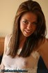 Petite brunette with big natural posing in white heels and lace lingerie
