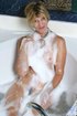 Horny granny with hairy pussy masturbates in bathtub while taking a bath.