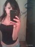 tatted-up brunette corset gets