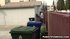 squatting alley behind trashcan