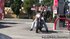 A black tube top hugs her busty chest as she rides on a motorcycle, wearing