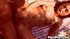 Lying back in the grass, she cups her supple breasts as he thrusts into